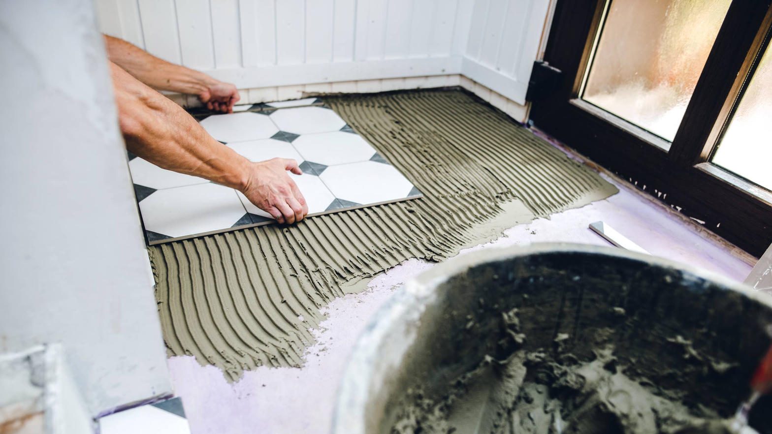 Bathroom floor tiling in progress